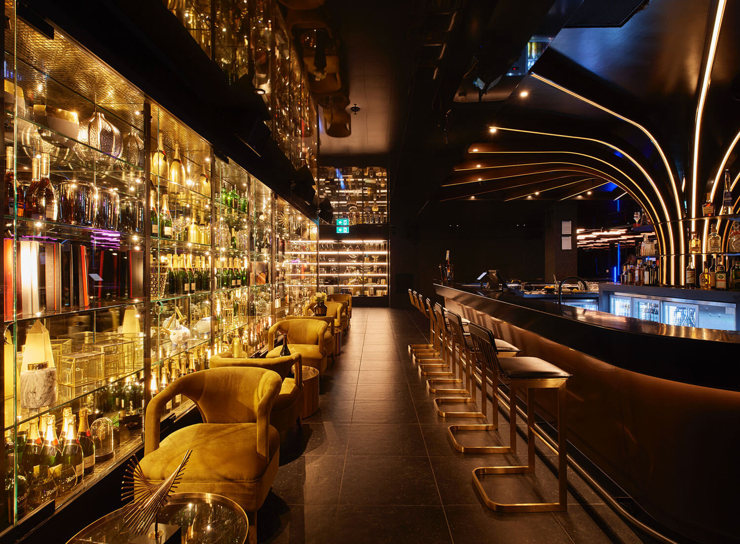 Luxurious bar image with golden lights and lounge area