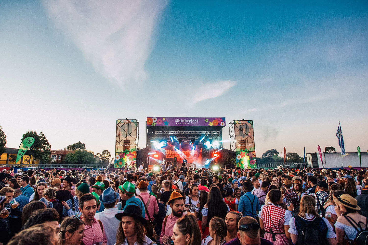 A crowd at a music festival dancing and having fun